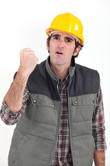 Construction worker raising his fist