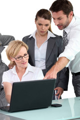 Fototapeta premium Business people around laptop