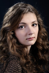 Fototapeta premium Girl with long curly hair.