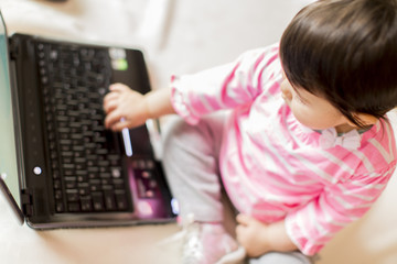 Fototapeta na wymiar Baby working on laptop