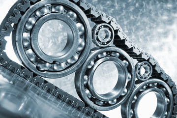 ball bearings and gears mirrored in titanium