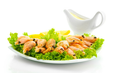 Boiled shrimps with lemon and lettuce leaves
