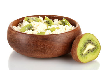 Cottage cheese in color bowl with kiwi fruit, isolated on white