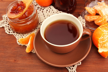 light breakfast with tea and homemade jam, on wooden table