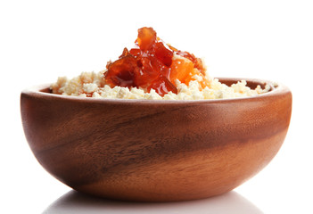 cottage cheese in wooden bowl with homemade tangerine jam,