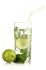 Glass of water with ice, mint and lime isolated on white