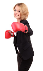 Young beautiful business woman with boxing gloves isolated