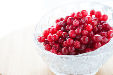 ripe cranberries in a glass bowl