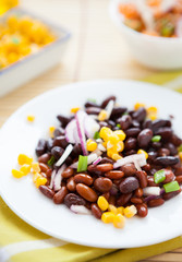 several kinds of legumes on a white plate