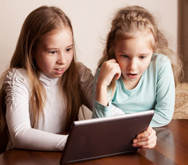 Children playing on tablet