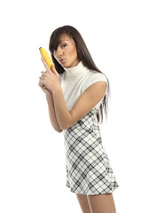 Positive attractive girl playing with banana