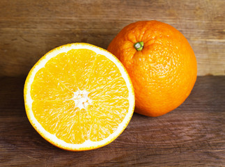 Fresh oranges on wooden background