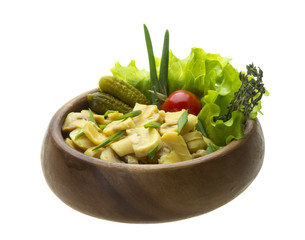 Marinated mushrooms in white saucer isolated on white