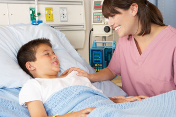 Nurse Visiting Child Patient On Ward
