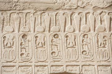 Egyptian hieroglyphic carvings on wall