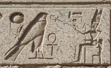 Egyptian hieroglyphic carvings on wall