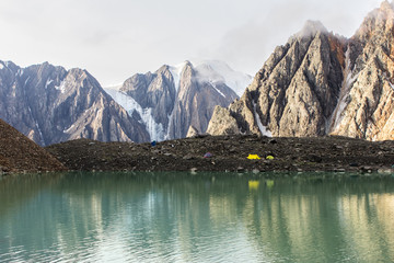 Tent on bank of mountain lake