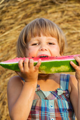 The portrait of the girl eats water-melon