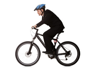 Obraz premium Businessman riding a bicycle