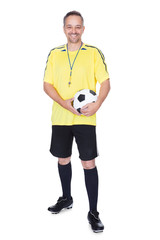 Portrait Of A Happy Soccer Player With A Football