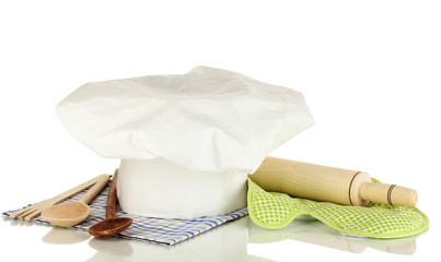 Chef's hat with kitchenware and battledore isolated on white