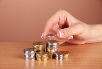 Woman hand with coins, close up