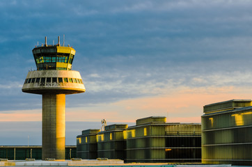 Airport control tower at sunset in Barcelona, Spain