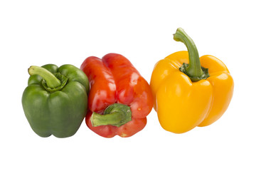 Red, yellow and green sweet pepper on white background