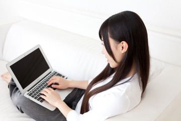 attractive asian woman using laptop