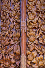 Wood carving decorated at windows of the temple, hand made by Th
