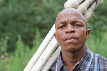 Worried South African entrepreneur small business broom salesman