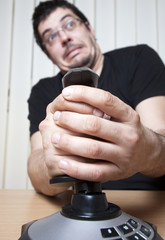 Funky man with a joystick - focus on joystick © Melinda Nagy