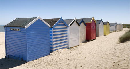 Fototapeta na wymiar Colorful beach huts at Southwold, Suffolk, England