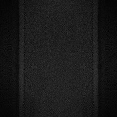 grey canvas background on black leather