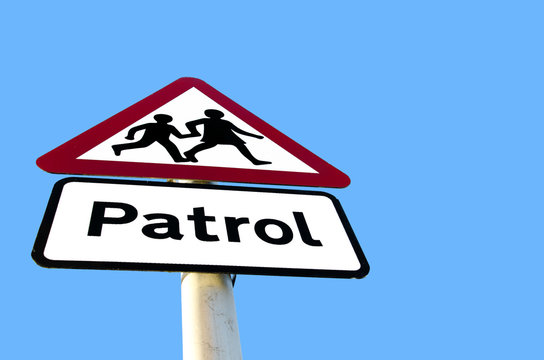 school patrol sign in blue sky background