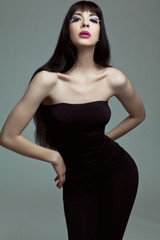 Naklejka premium Fashion model with long dark hair.