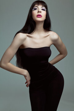 Fashion model with long dark hair.
