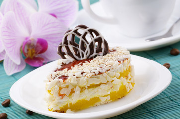 Dessert cake and coffee cup closeup photo