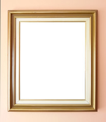 Empty golden frame on wall