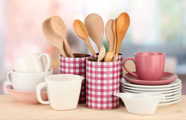 Cups, bowls nd other utensils in metal containers isolated