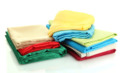 heap of cloth fabrics isolated on white
