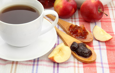 light breakfast with tea and homemade jam, on tablecloth