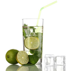 Glass of water with ice, mint and lime isolated on white