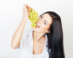 sexy happy woman eating grape