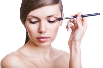 sexy woman with cosmetic brush on eye