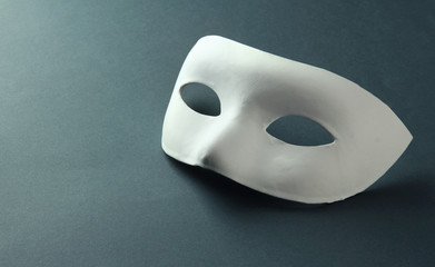 White mask, on grey background