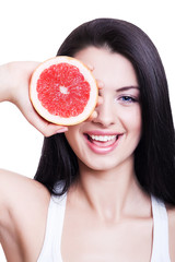 smiling girl with red grapefruit