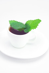 cup of tea and mint isolated on white
