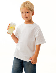 Young caucasian boy in white tee shirt drinking lemonade