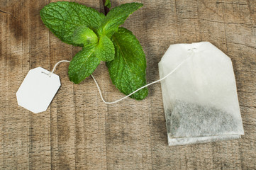 Tea bag and fresh mint